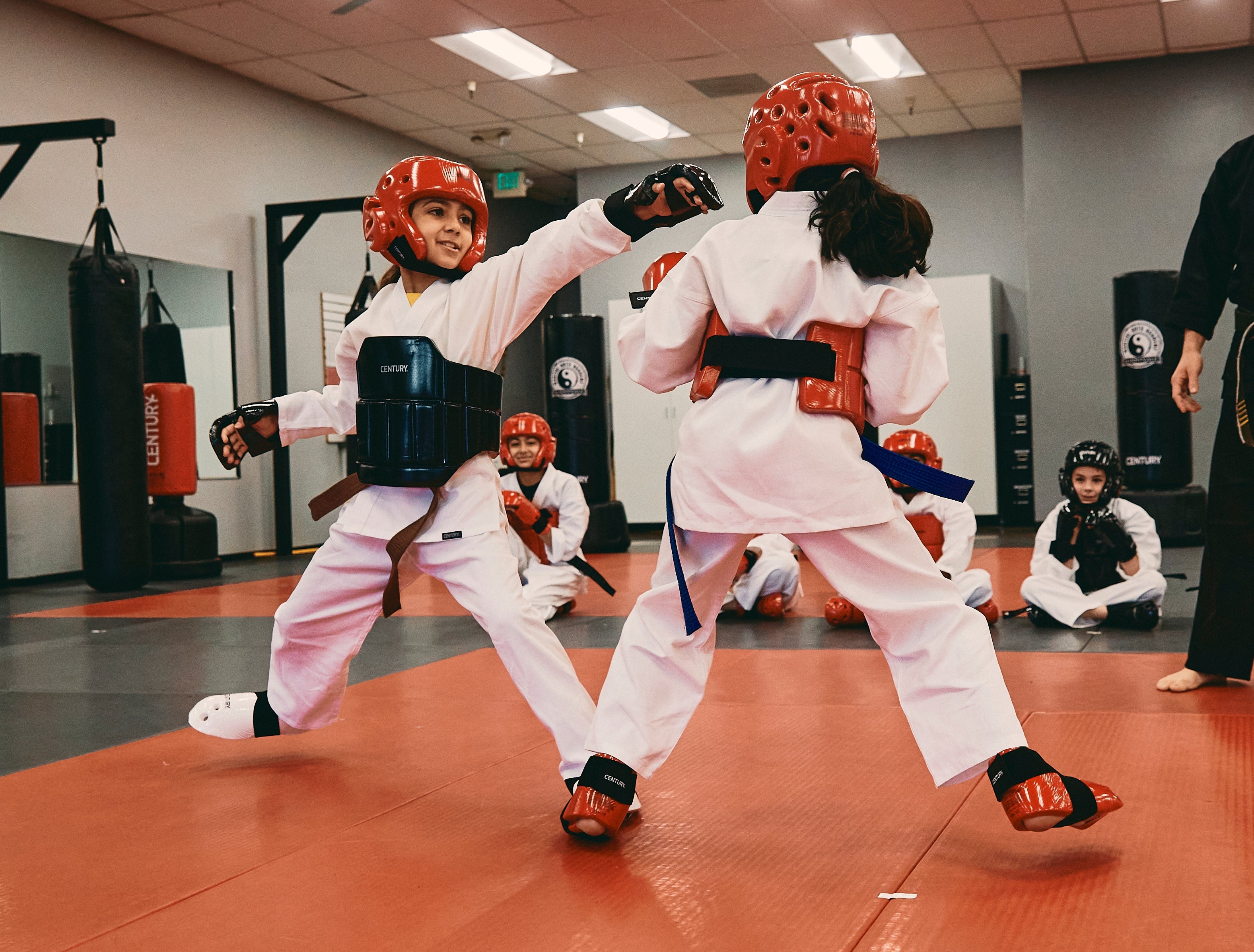 children training in martial arts class