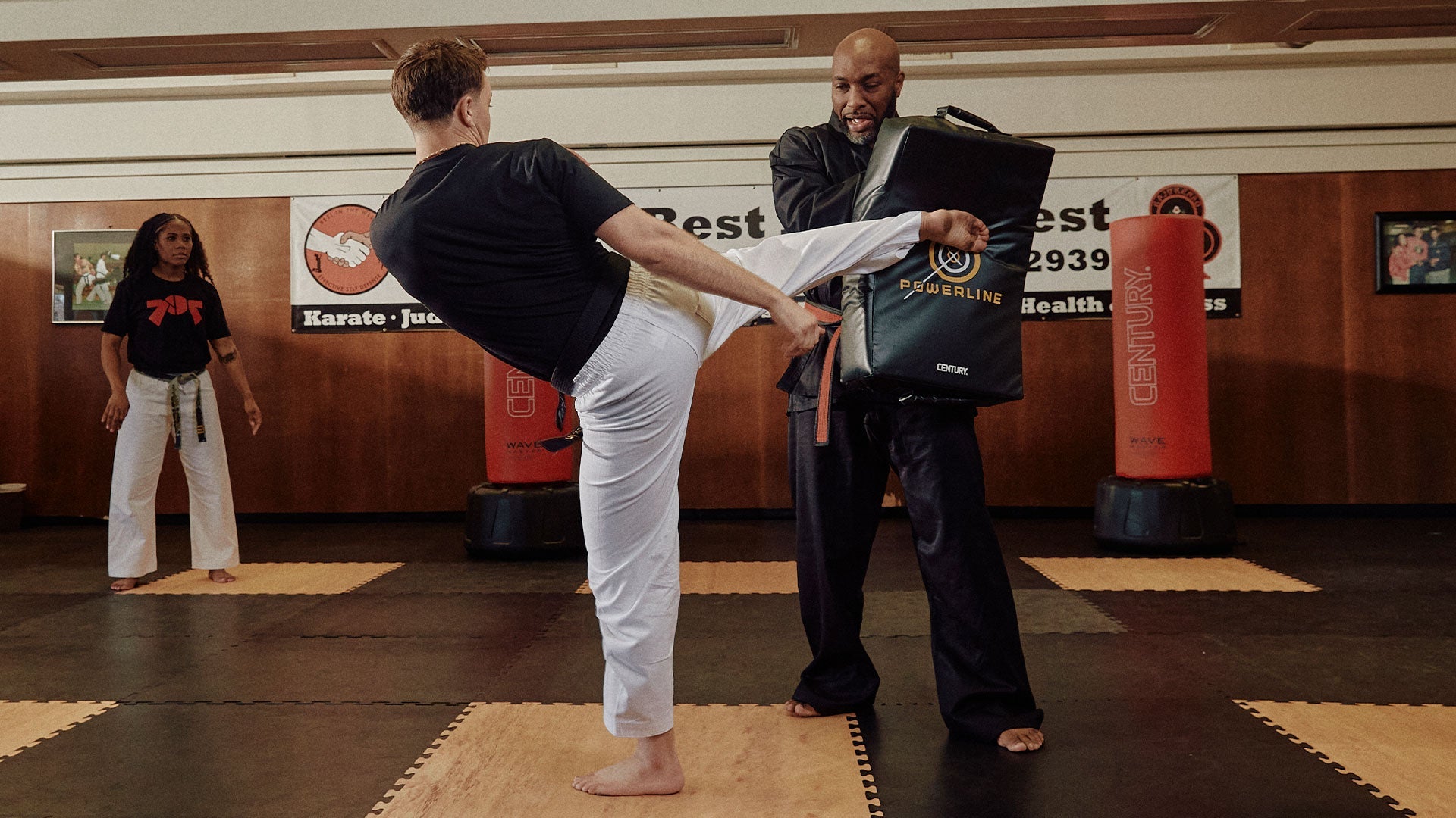 people training in martial arts class