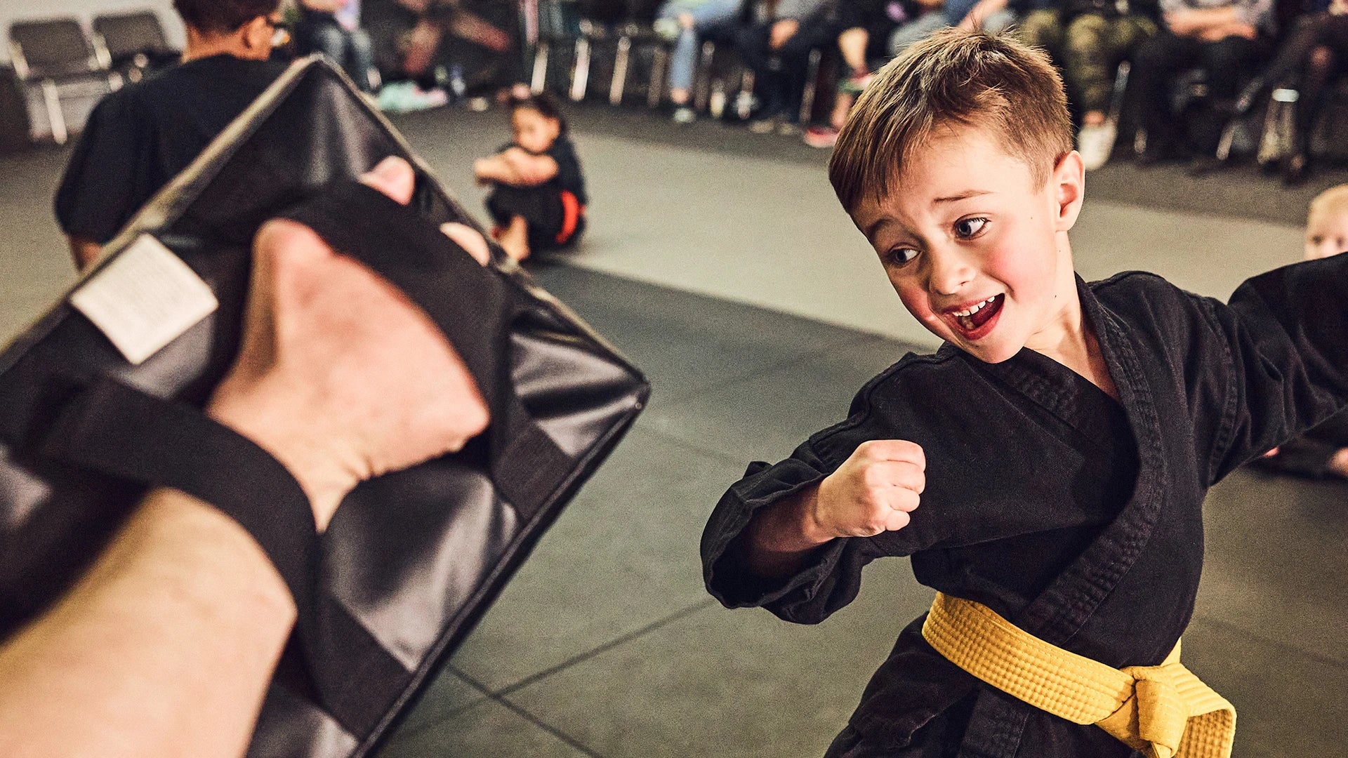 student in a martial arts school and an instructor