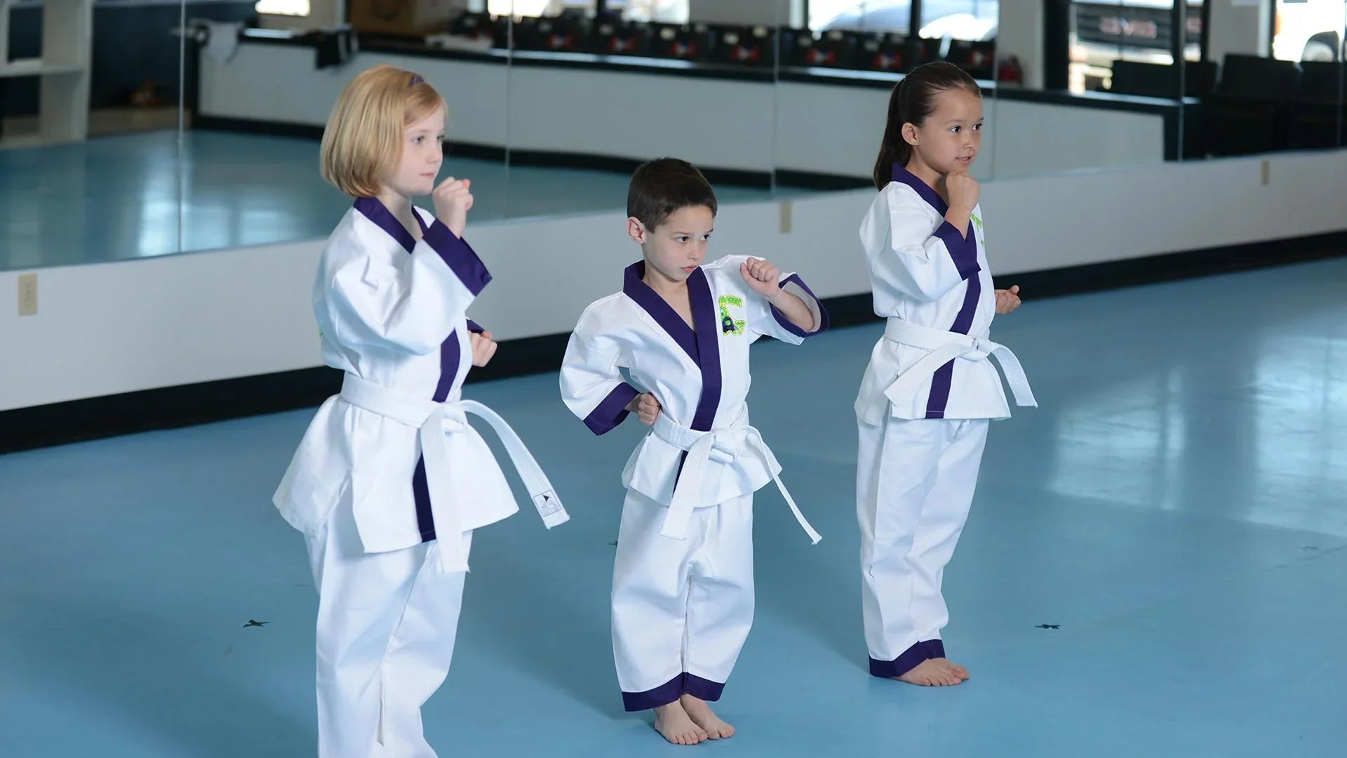 young students wearing little dragon uniforms