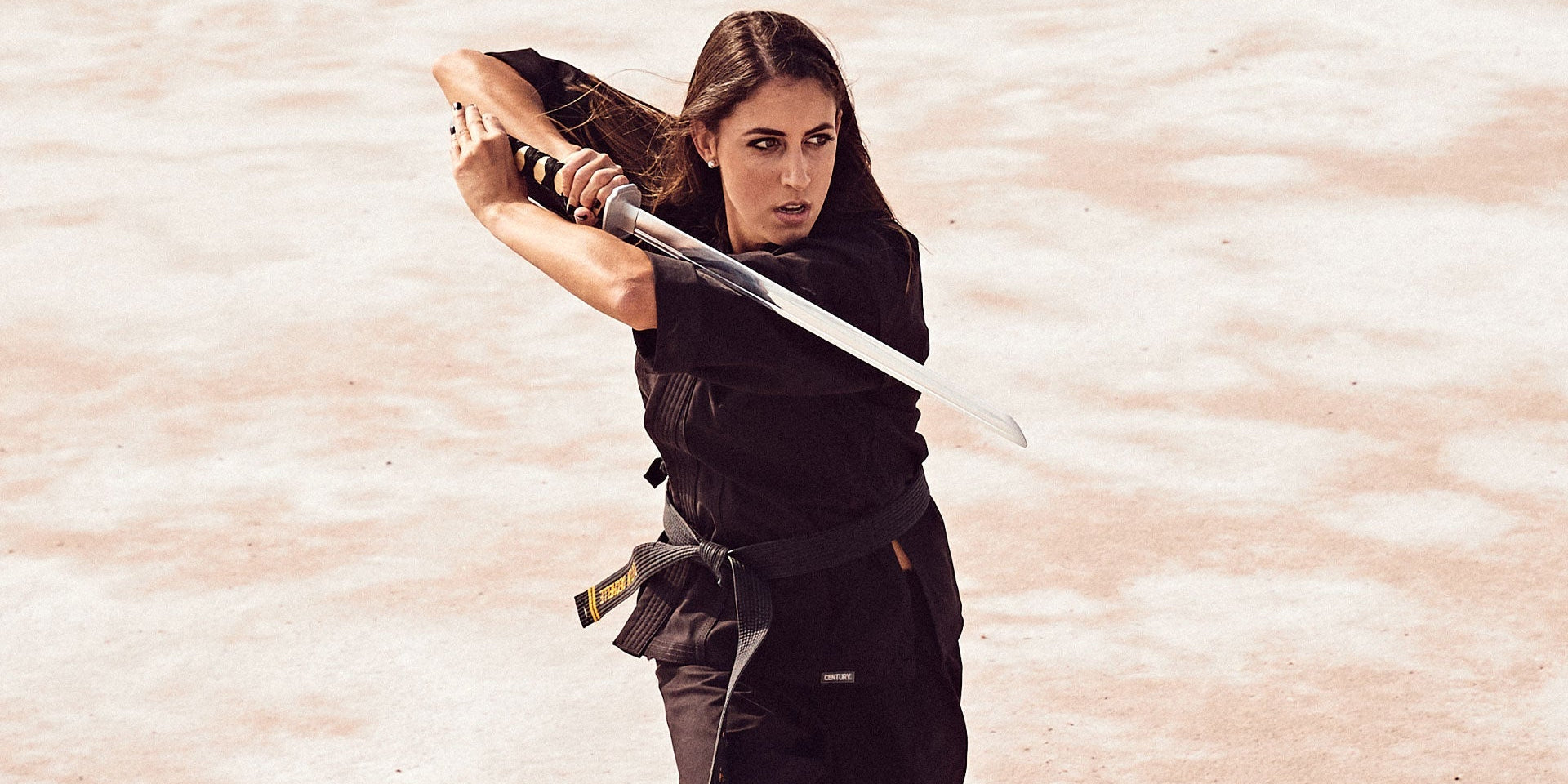 woman training in martial arts on salt plains
