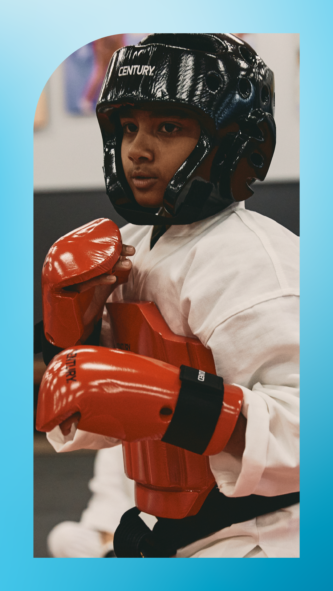 student in sparring gear in martial arts class