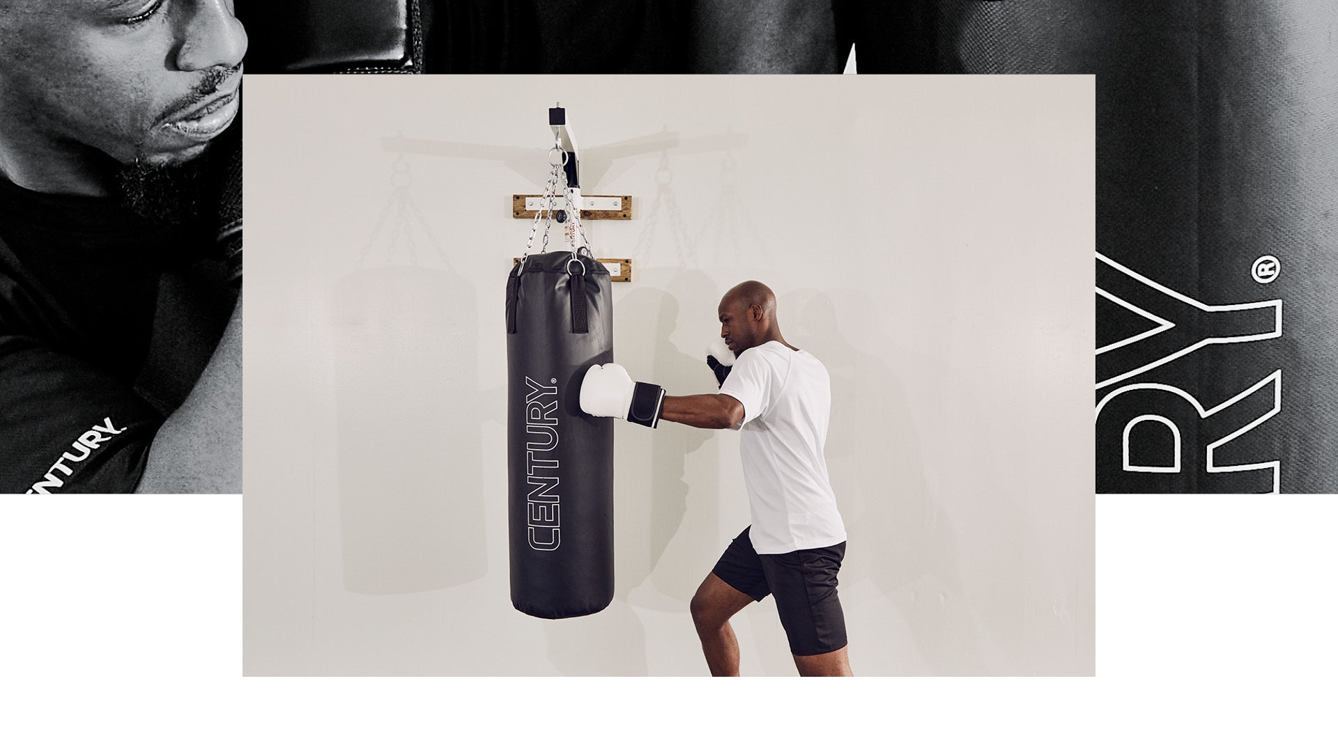 man punching century bag hanging on wall mount