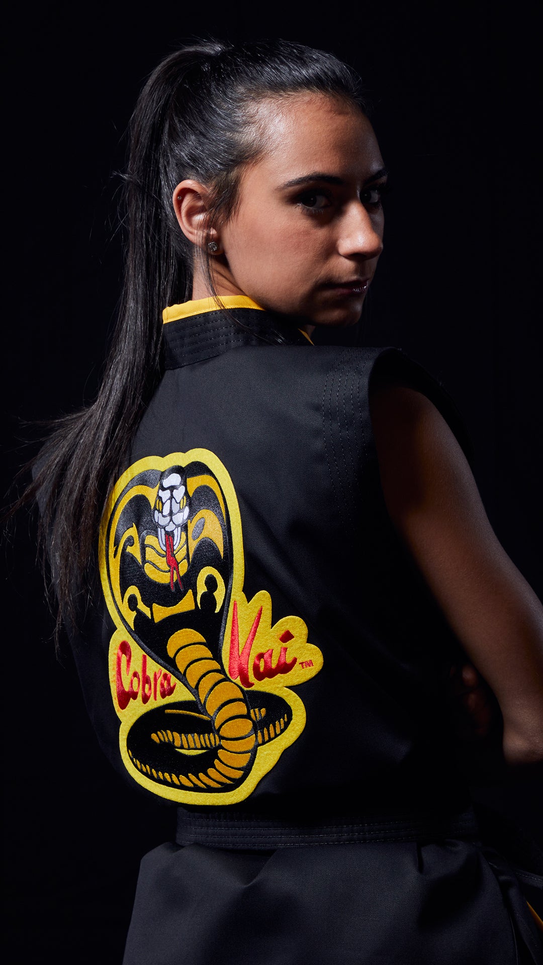 girl in cobra kai uniform