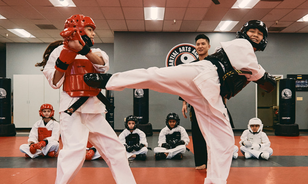 students sparring in gis and sparring gear