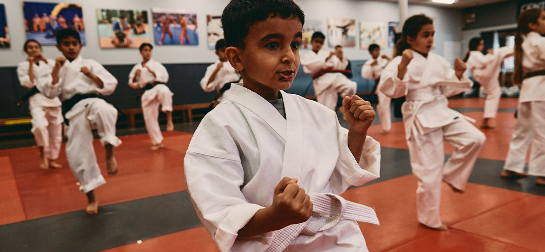 youth martial artists training in class