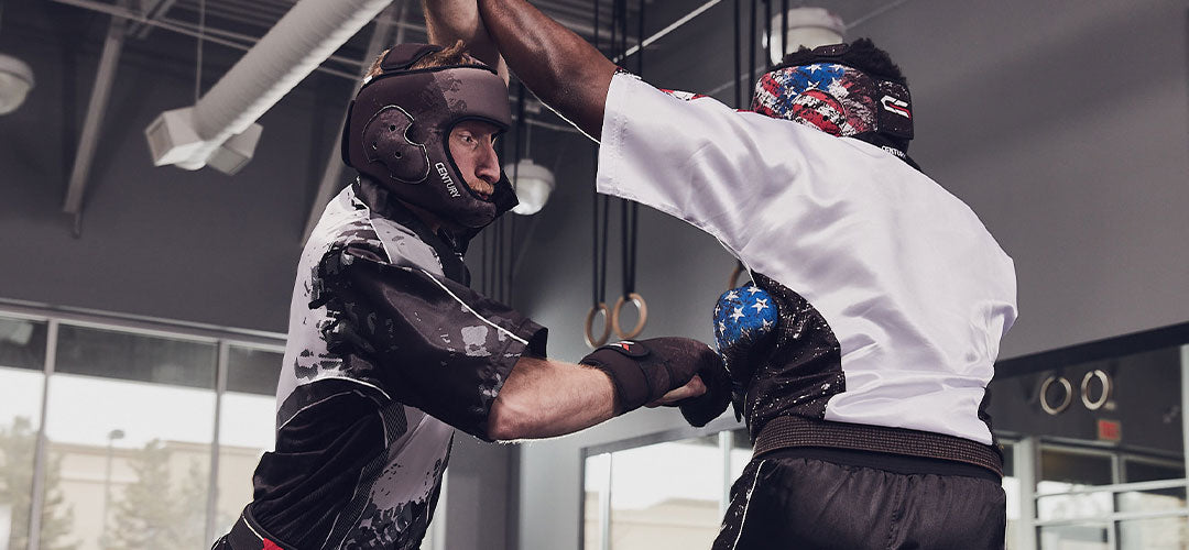 martial artists sparring in protective gear