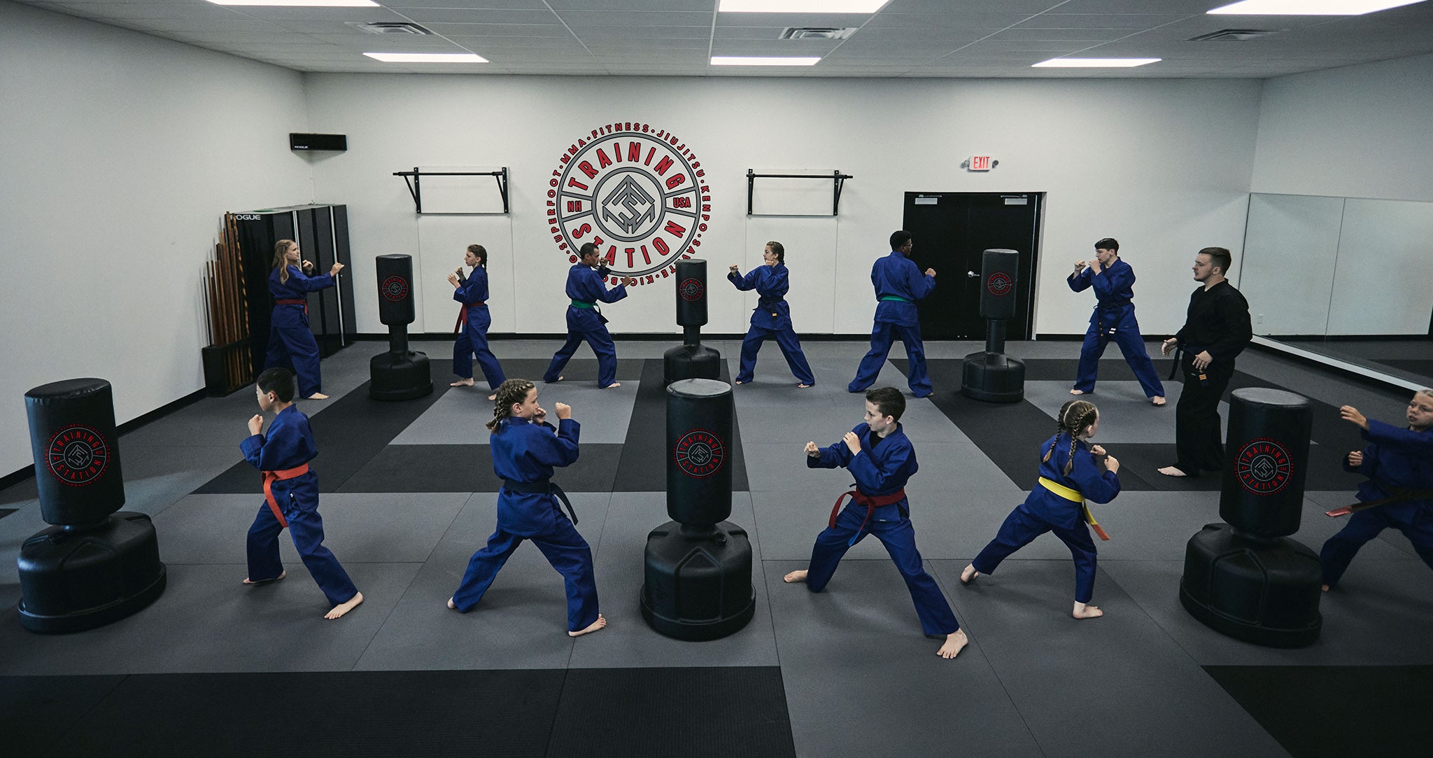 Martial artists training in class