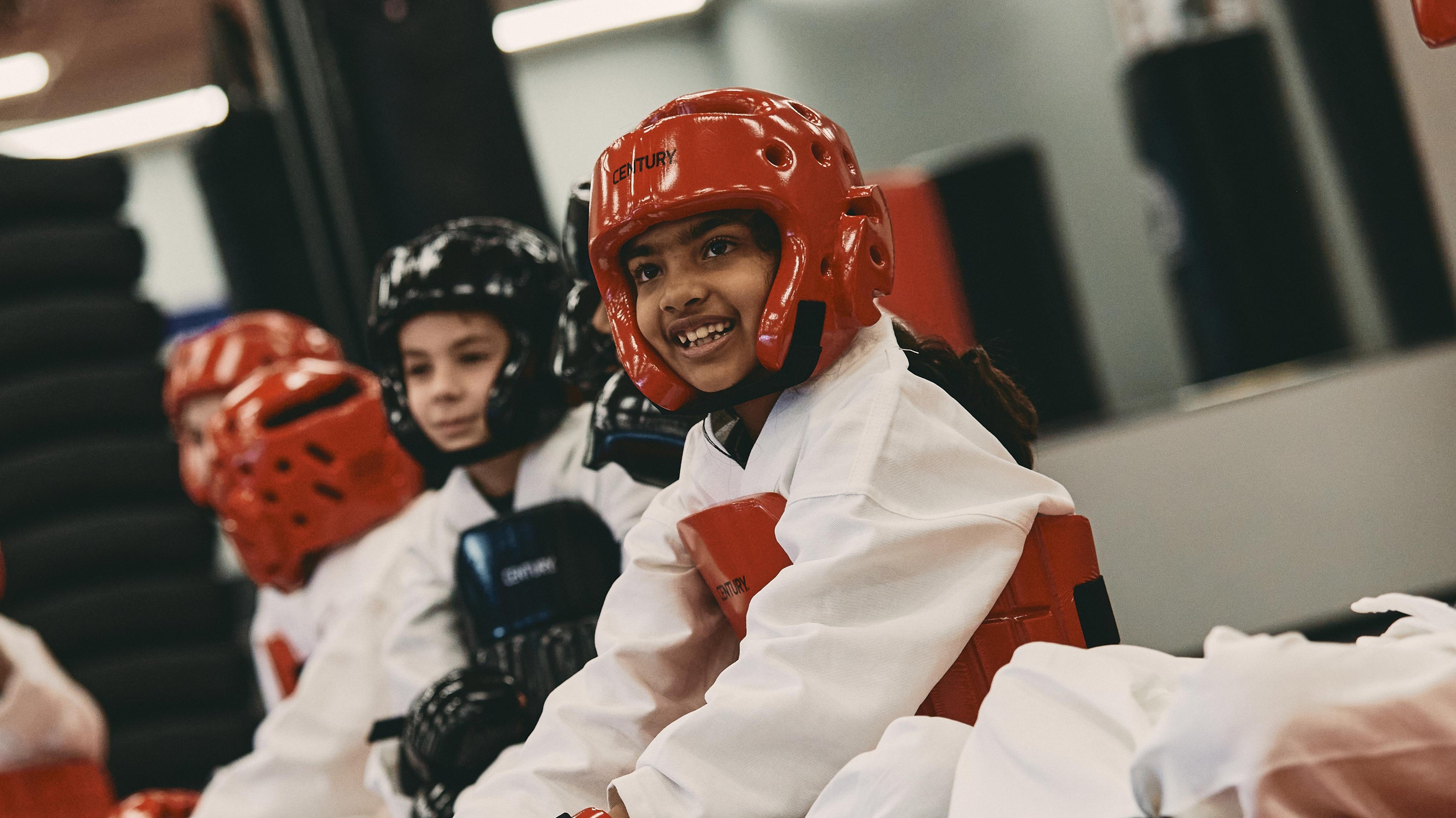 students in class wearing century sparring gear