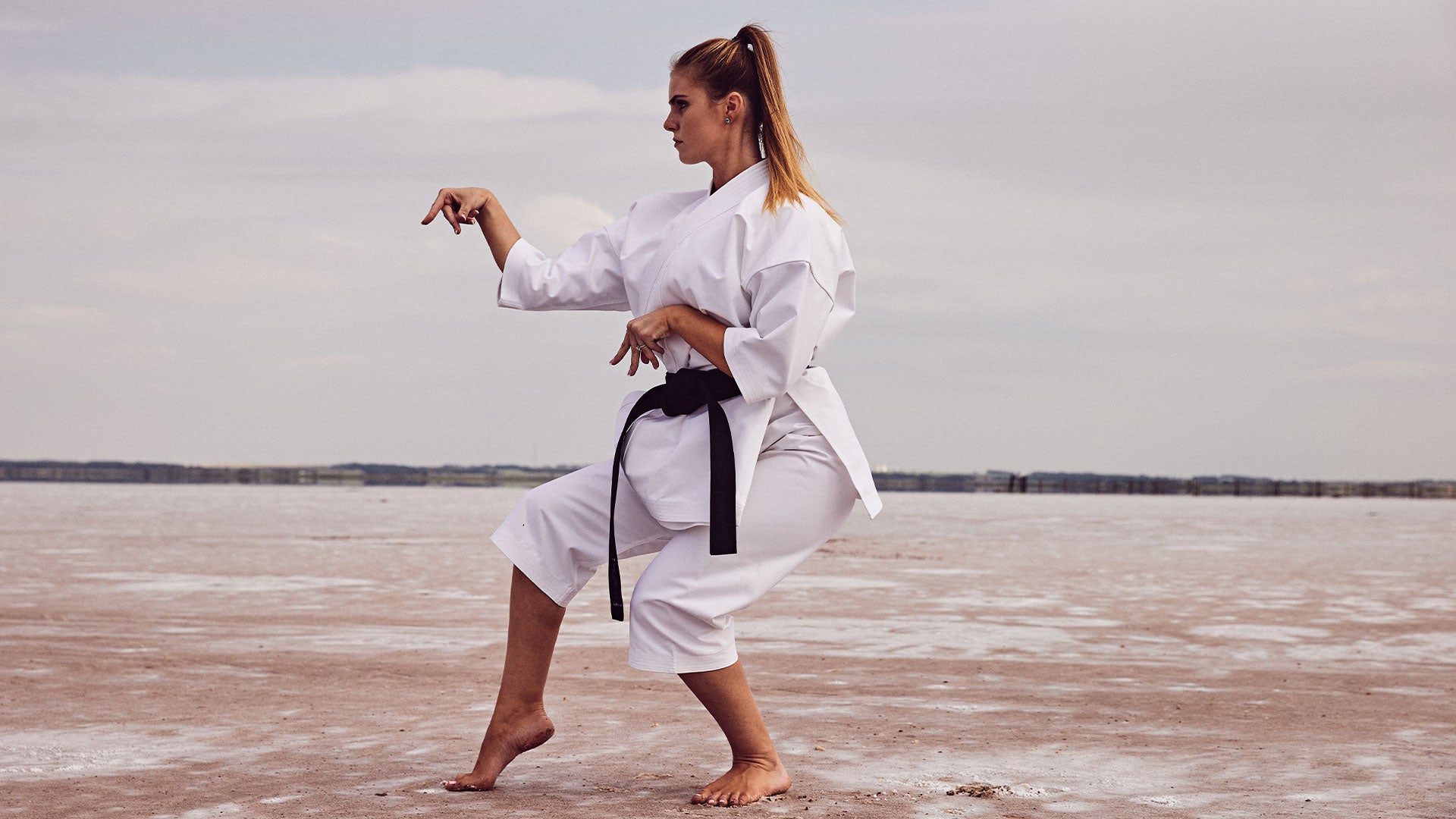 martial artist posing outside